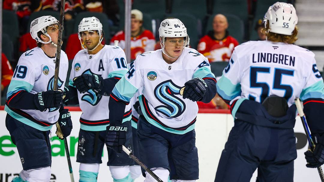 Oct 1, 2026; Calgary, Alberta, CAN; Seattle Kraken right wing Kaapo Kakko (84) celebrates his goal with teammates against the Calgary Flames during the third period at Scotiabank Saddledome. Mandatory Credit: Sergei Belski-Imagn Images