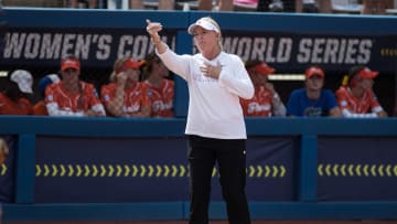 Jun 3, 2024;  Oklahoma City, OK, USA;  Oklahoma Sooners head coach Patty Gasso signals to her players in the fifth inning against the Florida Gators during a Women's College World Series softball semifinal game at Devon Park. Mandatory Credit: Brett Rojo-USA TODAY Sports