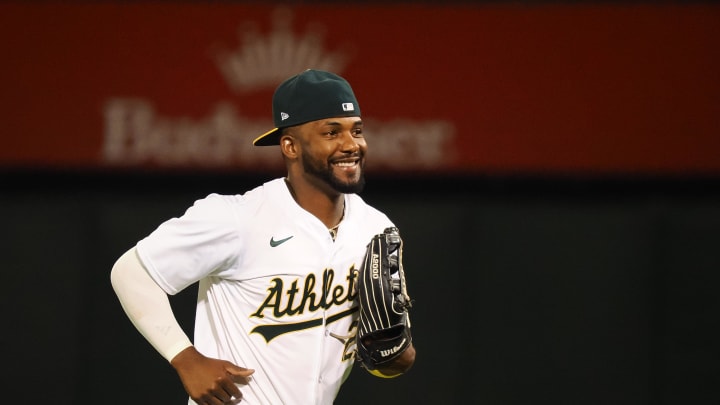 Jul 22, 2024; Oakland, California, USA; Oakland Athletics left fielder Miguel Andujar (22) smiles after a win against the Houston Astros at Oakland-Alameda County Coliseum. Mandatory Credit: Kelley L Cox-USA TODAY Sports