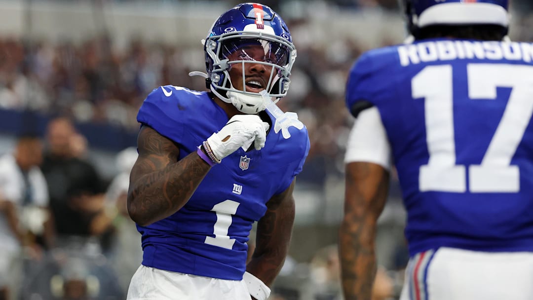 Sep 14, 2025; Arlington, Texas, USA; New York Giants wide receiver Malik Nabers (1) celebrates after scoring a touchdown against the Dallas Cowboys