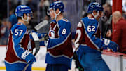 Nov 20, 2025; Denver, Colorado, USA; Colorado Avalanche defenseman Cale Makar (8) with center Tristen Nielsen (57) and left wing Artturi Lehkonen (62) after the game against the New York Rangers at Ball Arena. Mandatory Credit: Isaiah J. Downing-Imagn Images
