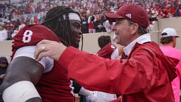 Sep 28, 2024; Bloomington, Indiana, USA;  Indiana Hoosiers defensive lineman CJ West (8) celebrates with vice president and director of intercollegiate athletics Scott Dolson after a game against the Maryland Terrapins at Memorial Stadium. Mandatory Credit: Robert Goddin-Imagn Images