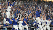 The Los Angeles Dodgers celebrate defeating the Toronto Blue Jays in the 18th inning of World Series Game 3.