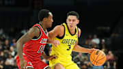 Nov 25, 2025; Las Vegas, Nevada, USA; Oregon Ducks guard Jackson Shelstad (3) drives the ball while San Diego State Aztecs guard BJ Davis (10) defends in the first half in a 2025 Players Era Festival group play game at Michelob Ultra Arena. Mandatory Credit: Kirby Lee-Imagn Images