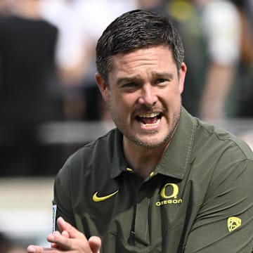 Sep 17, 2022; Eugene, Oregon, USA; Oregon Ducks head coach Dan Lanning encourages his team before a game against the Brigham Young Cougars at Autzen Stadium. Mandatory Credit: Troy Wayrynen-Imagn Images
