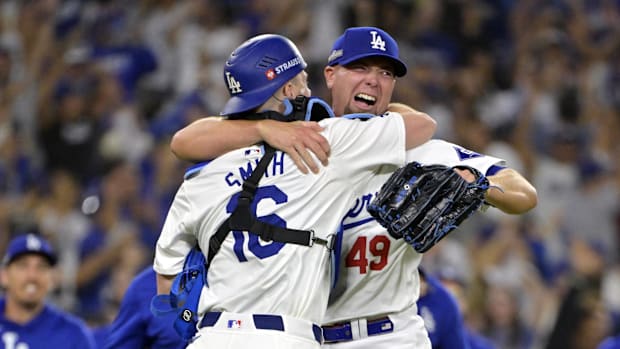 Dodgers pitcher Blake Treinen, right, celebrates winning the 2024 NLCS with catcher Will Smith, left.