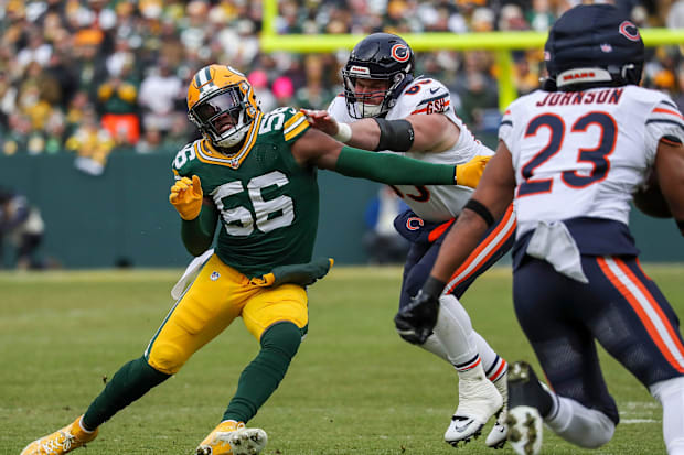 Green Bay Packers linebacker Edgerrin Cooper (56) beats a block by Chicago Bears center Coleman Shelton.