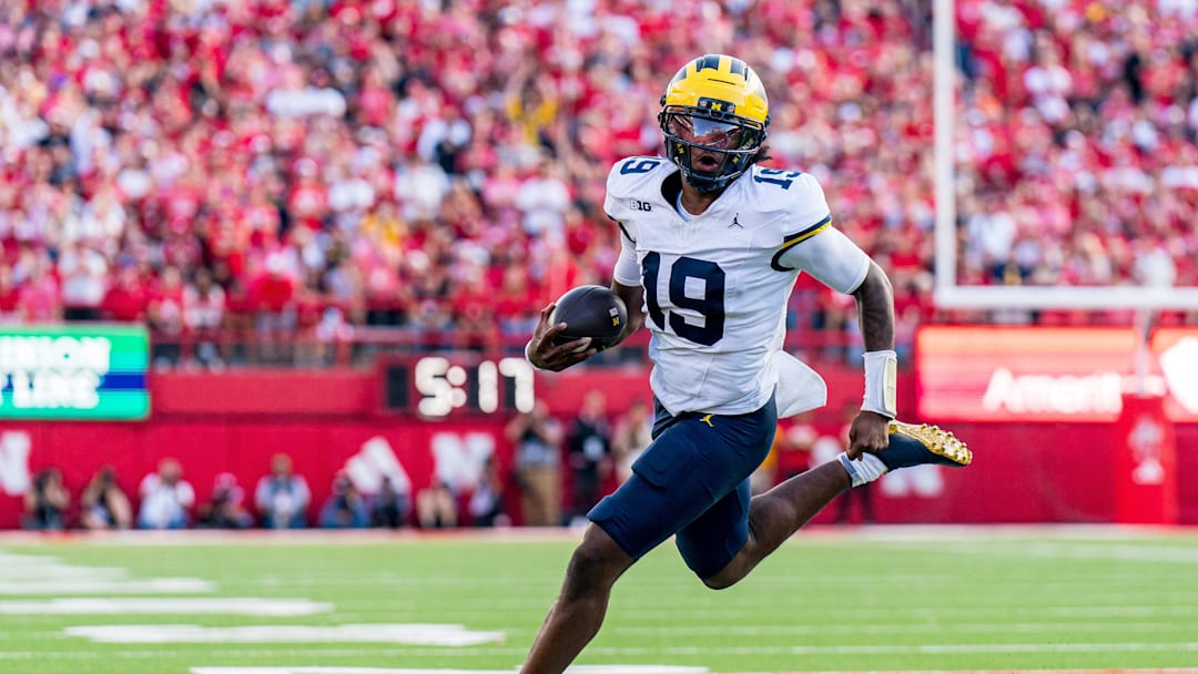Sep 20, 2025; Lincoln, Nebraska, USA; Michigan Wolverines quarterback Bryce Underwood (19) runs against the Nebraska Cornhuskers during the fourth quarter at Memorial Stadium. Mandatory Credit: Dylan Widger-Imagn Images