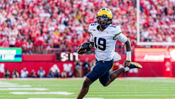 Sep 20, 2025; Lincoln, Nebraska, USA; Michigan Wolverines quarterback Bryce Underwood (19) runs against the Nebraska Cornhuskers during the fourth quarter at Memorial Stadium. Mandatory Credit: Dylan Widger-Imagn Images