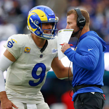 Oct 12, 2025; Baltimore, Maryland, USA; Los Angeles Rams quarterback Matthew Stafford (9) speaks with head coach Sean McVay during the second half of the game against the Baltimore Ravens at M&T Bank Stadium. Mandatory Credit: Peter Casey-Imagn Images