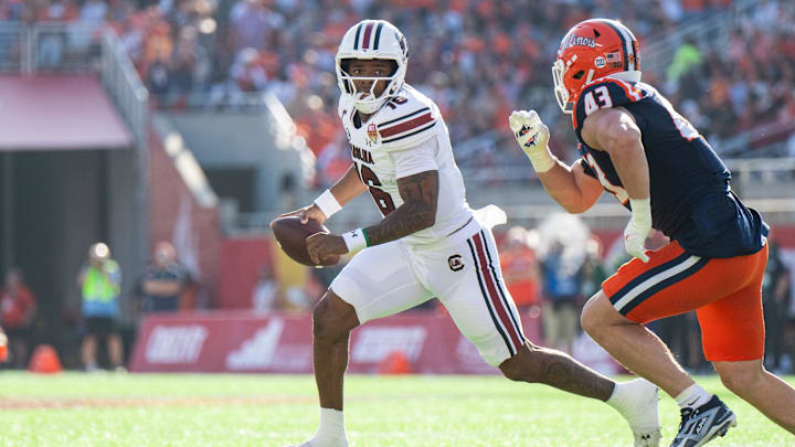 Dec 31, 2024; Orlando, FL, USA; South Carolina Gamecocks quarterback LaNorris Sellers (16) runs the ball against Illinois Fighting Illini linebacker Joe Barna (43) in the first quarter at Camping World Stadium. Mandatory Credit: Jeremy Reper-Imagn Images Dec 31, 2024; Orlando, FL, USA; South Carolina Gamecocks quarterback LaNorris Sellers (16) runs the ball against Illinois Fighting Illini linebacker Joe Barna (43) in the first quarter at Camping World Stadium. Mandatory Credit: Jeremy Reper-Imagn Images