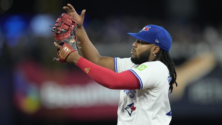 Apr 16, 2024; Toronto, Ontario, CAN; Toronto Blue Jays first baseman Vladimir Guerrero Jr. (27) catches a fly ball hit by New York Yankees center fielder Aaron Judge (not pictured) during the eighth inning at Rogers Centre.
