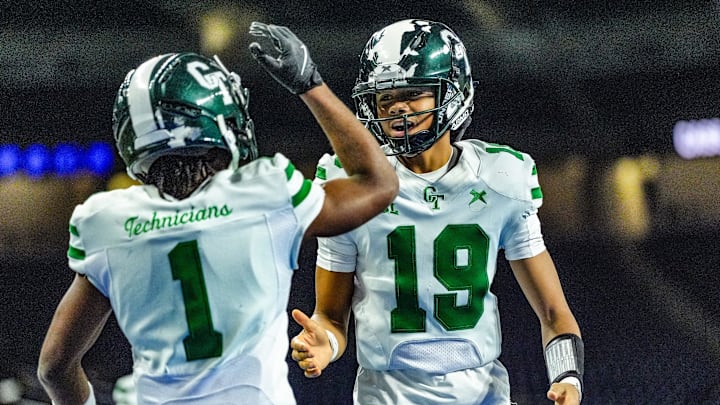 Detroit Cass Tech QB Donald Tabron II (19) celebrates Corey Sadler Jr.’s (1) touchdown against Hudsonville in the second quarter during the MHSAA Division 1 football finals at Ford Field in Detroit on Saturday, Nov. 30, 2024. Detroit Cass Tech QB Donald Tabron II (19) celebrates Corey Sadler Jr.’s (1) touchdown against Hudsonville in the second quarter during the MHSAA Division 1 football finals at Ford Field in Detroit on Saturday, Nov. 30, 2024.