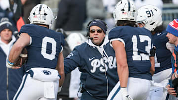 Penn State Nittany Lions head coach James Franklin celebrates with linebacker Dominic DeLuca (0)
