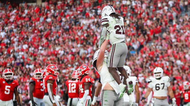 Oct 12, 2024; Athens, Georgia, USA; Mississippi State Bulldogs running back Davon Booth (21) celebrates after a touchdown with offensive lineman Luke Work (51) against the Georgia Bulldogs in the third quarter at Sanford Stadium. Mandatory Credit: Brett Davis-Imagn Images
