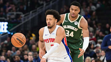 Dec 16, 2023; Milwaukee, Wisconsin, USA;  Detroit Pistons guard Cade Cunningham (2) is guarded by Milwaukee Bucks forward Giannis Antetokounmpo (34): Benny Sieu-Imagn Images