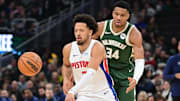 Dec 16, 2023; Milwaukee, Wisconsin, USA;  Detroit Pistons guard Cade Cunningham (2) is guarded by Milwaukee Bucks forward Giannis Antetokounmpo (34) in the first quarter at Fiserv Forum. Mandatory Credit: Benny Sieu-Imagn Images