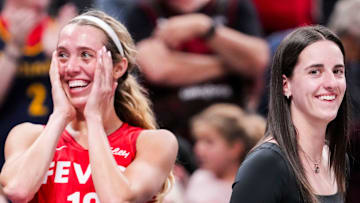 Indiana Fever guard Lexie Hull (10) and Indiana Fever guard Caitlin Clark (22) smile from the bench Friday, Sept. 5, 2025, during a game between the Indiana Fever and the Chicago Sky at Gainbridge Fieldhouse in Indianapolis. The Indiana Fever defeated the Chicago Sky, 97-77.