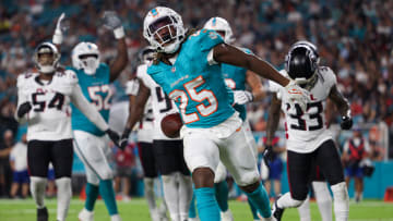 Aug 9, 2024; Miami Gardens, Florida, USA; Miami Dolphins running back Jaylen Wright (25) celebrates after scoring a touchdown against the Atlanta Falcons in the second quarter during preseason at Hard Rock Stadium. Mandatory Credit: Nathan Ray Seebeck-USA TODAY Sports