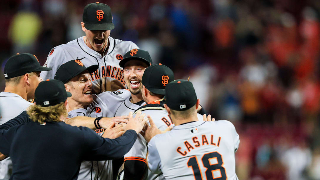 San Francisco Giants teammates congratulate pitcher Blake Snell after he threw a no-hitter against the Cincinnati Reds at Great American Ball Park.