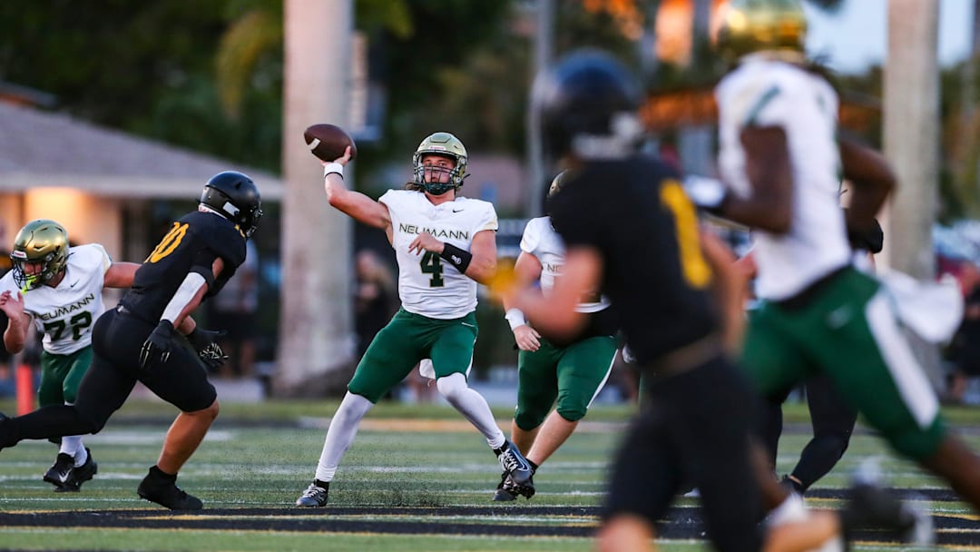 Neumann Celtics quarterback Peyton Frontino (4) makes a pass while being pressured by Bishop Verot Vikings linebacker JJ Bolz (10) during the first quarter of a preseason game at Bishop Verot High School in Fort Myers, Fla., on Friday, Aug. 15, 2025.