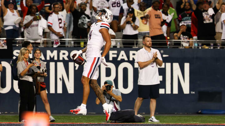 Aug 31, 2024; Tucson, Arizona, USA; Arizona Wildcats wide receiver Tetairoa McMillan (4) celebrates a touchdown during first quarter at Arizona Stadium. at Arizona Stadium. 