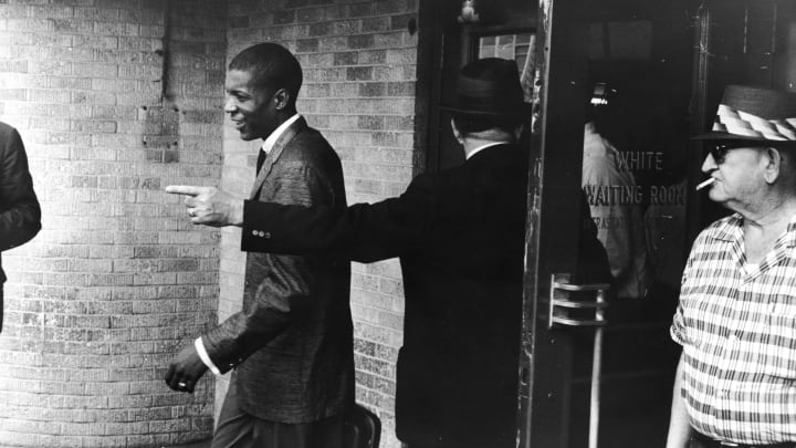 A Freedom Rider getting kicked out of a bus depot, 1961.
