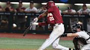 Alabama base runner Andrew Pinckney (21) connects for a triple to right at Sewell-Thomas Stadium in Tuscaloosa, Ala., Saturday June 4, 2023. Alabama defeated Troy 11-8 in the winners bracket game of the NCAA Regional Baseball Tournament.