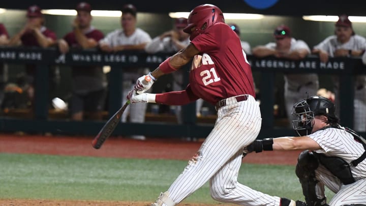 Alabama base runner Andrew Pinckney (21) connects for a triple to right at Sewell-Thomas Stadium in Tuscaloosa, Ala., Saturday June 4, 2023. Alabama defeated Troy 11-8 in the winners bracket game of the NCAA Regional Baseball Tournament.