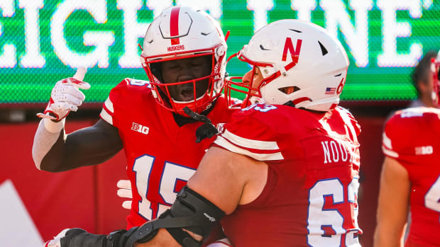 Nebraska Cornhuskers wide receiver Malachi Coleman (15) and offensive lineman Nouredin Nouili (63) celebrate.