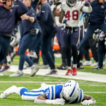 Indianapolis Colts running back Tyler Goodson (31) lies on the turf after missing a catch on fourth down Saturday, Jan. 6, 2024, during a game against the Houston Texans at Lucas Oil Stadium in Indianapolis.