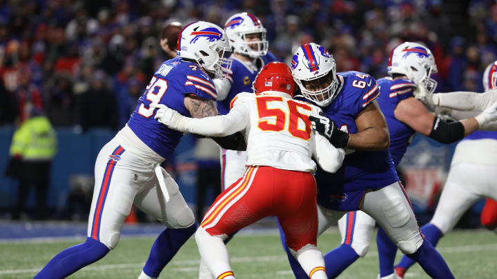 Bills Spencer Brown and O'Cyrus Torrence block Chiefs George Karlaftis while QB Josh Allen fires off a pass during the second half of the Bills divisional game against Kansas City Chiefs at Highmark Stadium in Orchard Park on Jan. 21, 2024.