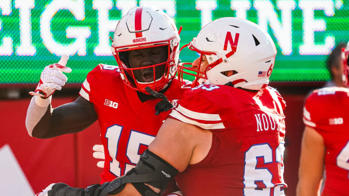 Oct 21, 2023; Lincoln, Nebraska, USA; Nebraska Cornhuskers wide receiver Malachi Coleman (15) and offensive lineman Nouredin Nouili (63) celebrate after a touchdown by Coleman against the Northwestern Wildcats during the fourth quarter at Memorial Stadium.