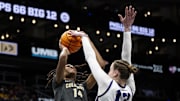 Mar 7, 2025; Kansas City, MO, USA; TCU Horned Frogs center Sedona Prince (13) blocks a shot by Colorado Buffaloes forward Jade Masogayo (14) during the third quarter at T-Mobile Center. Mandatory Credit: Amy Kontras-Imagn Images