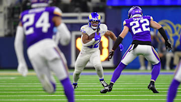 Oct 24, 2024; Inglewood, California, USA; Los Angeles Rams running back Blake Corum (22) runs the ball against the Minnesota Vikings during the second half at SoFi Stadium. Mandatory Credit: Gary A. Vasquez-Imagn Images