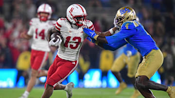 Nebraska Cornhuskers wide receiver Nyziah Hunter runs the ball against UCLA Bruins defensive back Key Lawrence during the second half at the Rose Bowl.