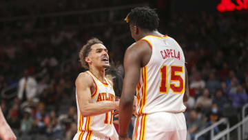 Mar 31, 2022; Atlanta, Georgia, USA; Atlanta Hawks guard Trae Young (11) and center Clint Capela (15) celebrate after an alley oop against the Cleveland Cavaliers in the second half at State Farm Arena. Mandatory Credit: Brett Davis-USA TODAY Sports
