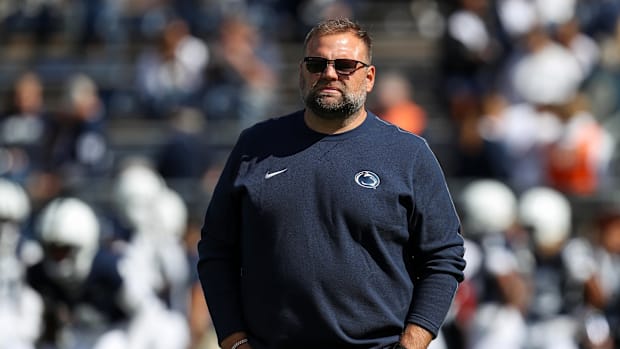 Sep 7, 2024; University Park, Pennsylvania, USA; Penn State Nittany Lions offensive coordinator Andy Kotelnicki walks on the 