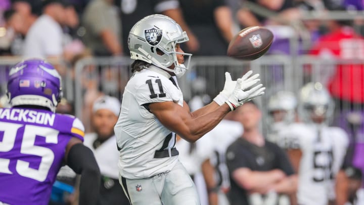 Aug 10, 2024; Minneapolis, Minnesota, USA; Las Vegas Raiders wide receiver Tre Tucker (11) catches a pass against the Minnesota Vikings in the second quarter at U.S. Bank Stadium. Mandatory Credit: Brad Rempel-USA TODAY Sports