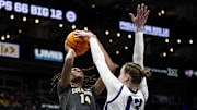 Mar 7, 2025; Kansas City, MO, USA; TCU Horned Frogs center Sedona Prince (13) blocks a shot by Colorado Buffaloes forward Jade Masogayo (14) during the third quarter at T-Mobile Center. Mandatory Credit: Amy Kontras-Imagn Images
