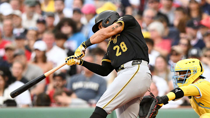 Aug 30, 2025; Boston, Massachusetts, USA; Pittsburgh Pirates left fielder Tommy Pham (28) hits a RBI single against the Boston Red Sox during the fifth inning at Fenway Park. Mandatory Credit: Brian Fluharty-Imagn Images