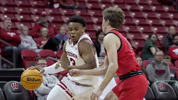 Wisconsin guard Camren Hunter (3) is guarded by UW-River Falls's Reggie Postel (14) during the second half of their preseason game Wednesday, October 30, 2024 at the Kohl Center in Madison, Wisconsin. Wisconsin beat UW-River Falls 78-62.