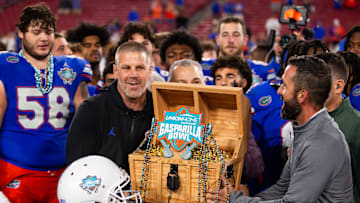 Florida Gators head coach Billy Napier lifts the 2024 Union Home Mortgage Gasparilla Bowl trophy in Raymond James Stadium in Tampa, FL on Friday, December 20, 2024 after defeating Tulane 33-8. [Doug Engle/Gainesville Sun]