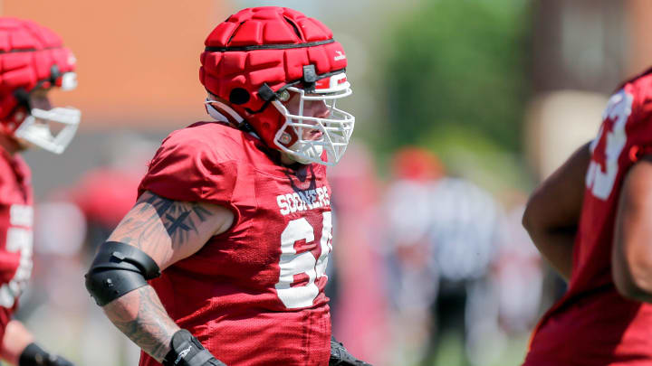 Josh Bates (64) runs drills during an Oklahoma football practice in Norman, Okla., on Friday, April 12, 2024.