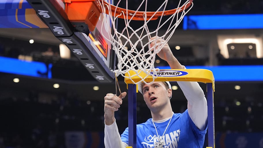 Cooper Flagg cuts down the net after Duke’s 2025 ACC tournament title.