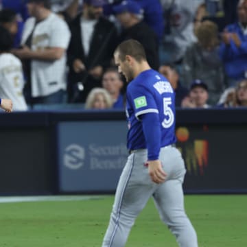 Oct 27, 2025; Los Angeles, California, USA; Los Angeles Dodgers pitcher Roki Sasaki (11) reacts after the ninth inning against the Toronto Blue Jays in game three of the 2025 MLB World Series at Dodger Stadium. Mandatory Credit: Kiyoshi Mio-Imagn Images