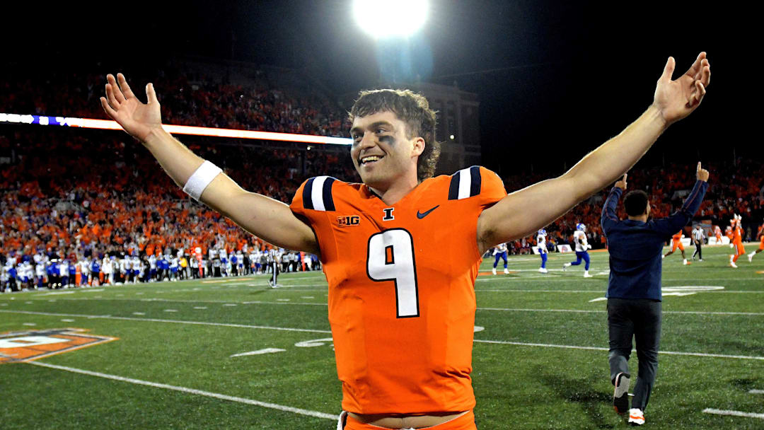 Sep 7, 2024; Champaign, Illinois, USA; Illinois Fighting Illini quarterback Luke Altmyer (9) celebrates a win over the Kansas Jayhawks at Memorial Stadium. Mandatory Credit: Ron Johnson-Imagn Images