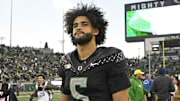 Nov 22, 2025; Eugene, Oregon, USA; Oregon Ducks quarterback Dante Moore (5) walks off the field after the game against the Southern California Trojans at Autzen Stadium. Mandatory Credit: Troy Wayrynen-Imagn Images