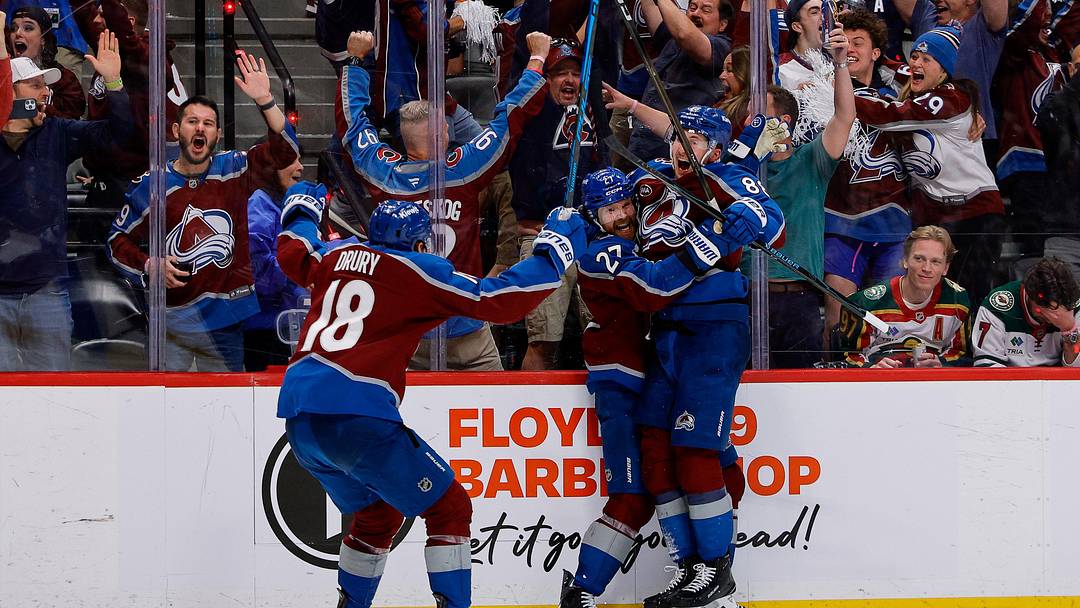 May 13, 2026; Denver, Colorado, USA; Colorado Avalanche defenseman Brett Kulak (27) celebrates his goal with center Martin Necas (88) and center Jack Drury (18) in overtime against the Minnesota Wild in game five of the second round of the 2026 Stanely Cup Playoffs at Ball Arena. Mandatory Credit: Isaiah J. Downing-Imagn Images
