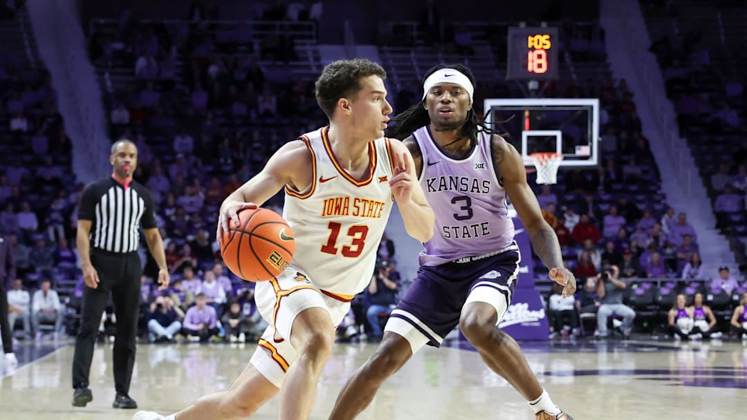 Feb 1, 2026; Manhattan, Kansas, USA; Iowa State Cyclones guard Code Kelderman (13) dribbles against Kansas State Wildcats guard C.J. Jones (3) during the second half at Bramlage Coliseum. Mandatory Credit: Scott Sewell-Imagn Images